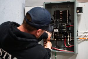 Fully licensed master electrician from Postma electrical upgrading older homes electrical panel to meet current ESA code regulations.